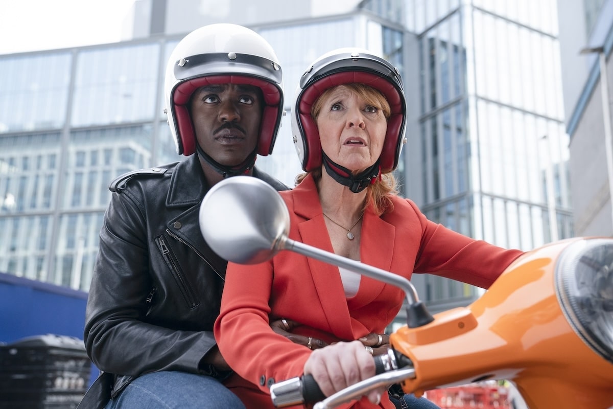 The Fifteenth Doctor and Mel Bush escaping the Death via Vespa in "Empire of Death"
