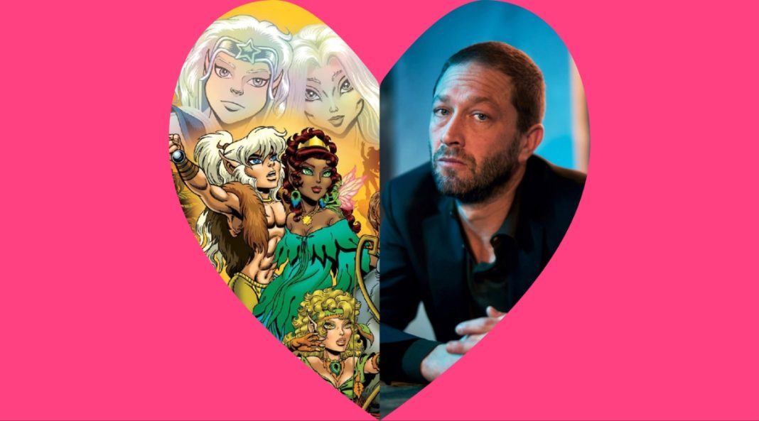 A heart in a field of pink. On one side is Elfquest, on the other is Ebon Moss-Bachrach.