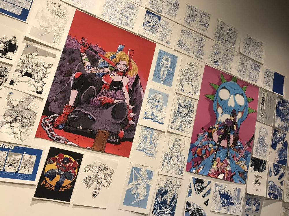 Various prints, sketches and line drawings by Acky Bright featuring characters such as Harley Quinn, Optimus Prime and Punchline. 