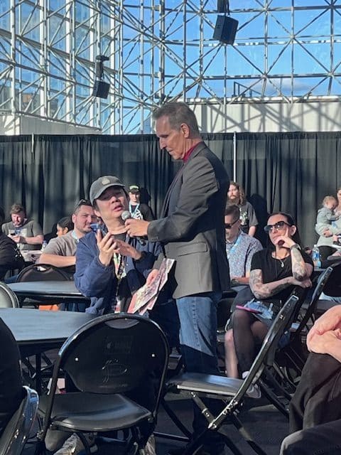 Todd McFarlane interviews a retailer at NYCC