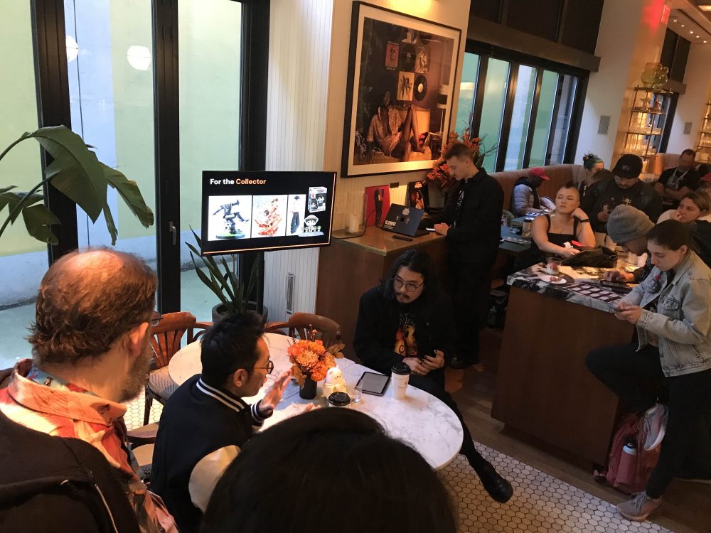 Tim and Terry were discussing Crunchyroll, surrounded by various media members and guests listening. 