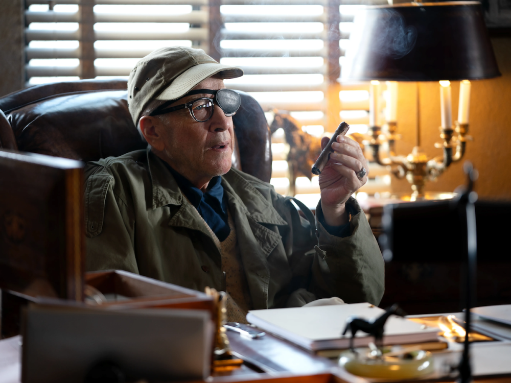 David Lynch, as John Ford, sits in his office.