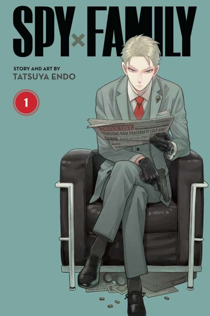 Cover of Spy X Family Volume 1. Lord, a blond man wearing a suit and tie, sat in a chair reading a newspaper.