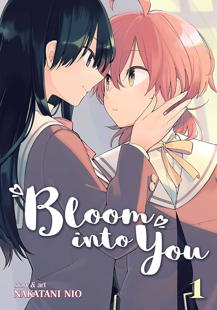 cover of bloom into you volume 1 depicting the love interest holding the protagonist's face in her hands